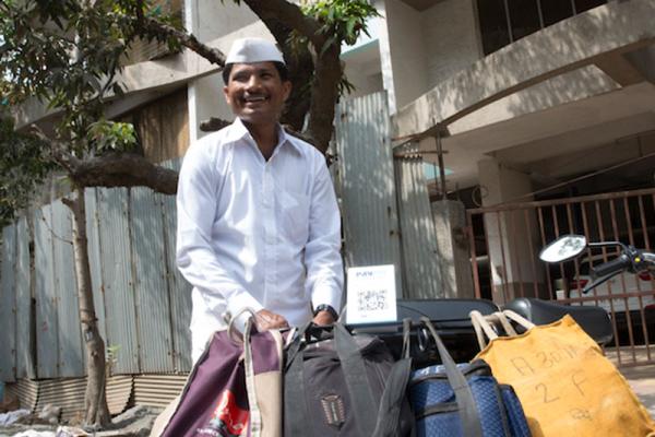 Vilash and other dabbawalas can now collect instant digital payments for delivering hundreds of thousands of home-cooked lunches every day.  Photo credit: UNSGSA/Ruhani Kaur