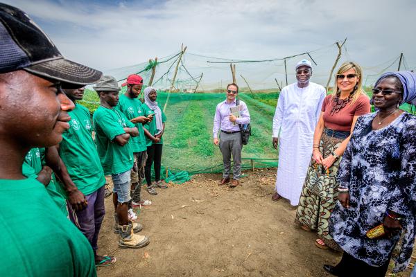 UNSGSA Queen Máxima meets with Mame Fatin Gueye (far right), an agricultural entrepreneur, and her employees, while learning about index-based insurance products developed by the National Agricultural Insurance Company of Senegal (CNAAS) to help farmers build resilience to climate shocks. Mouhamadou Moustapha Fall, Director General of CNAAS, is pictured third from the right. Photo credit: Patrick van Katwijk