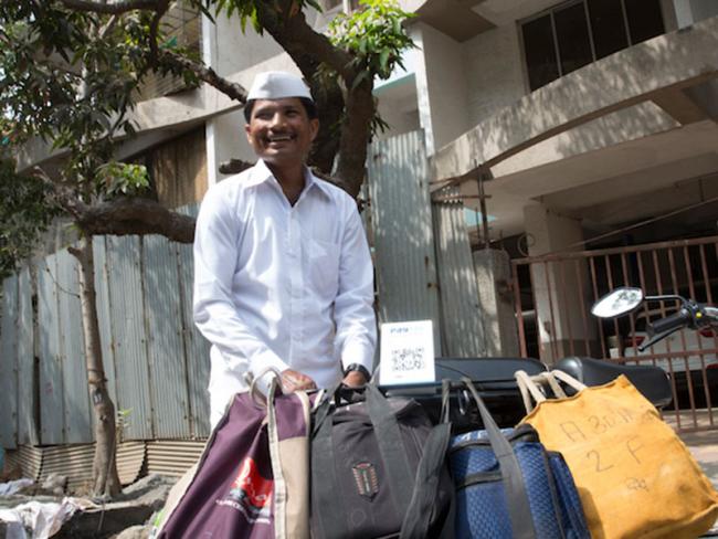 Vilash and other dabbawalas can now collect instant digital payments for delivering hundreds of thousands of home-cooked lunches every day.  Photo credit: UNSGSA/Ruhani Kaur